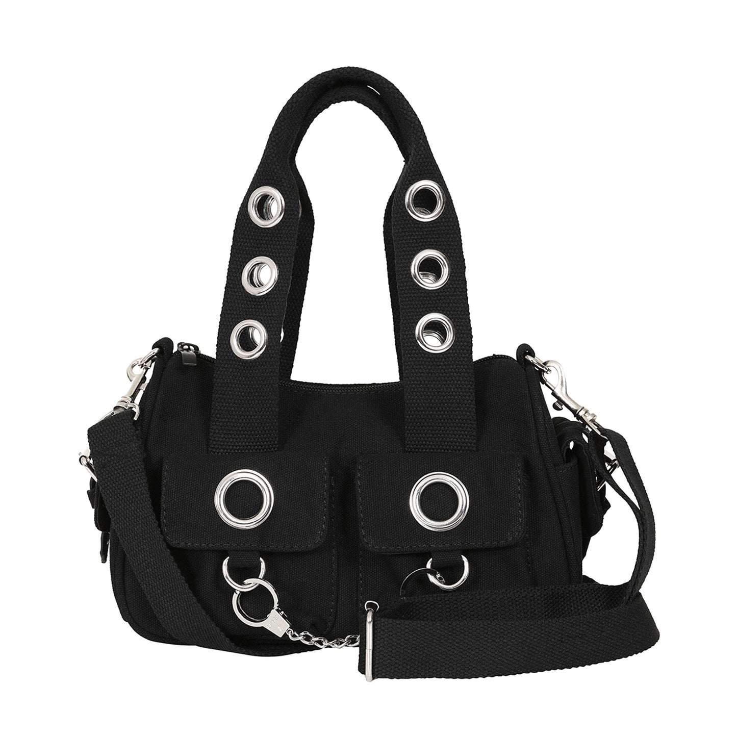 Bolso de mano o bandolera con ojales metálicos en los bolsillos y en las asas. Fabricado en tela de algodón y con esposas de decoración en la parte frontal. Vista con correa