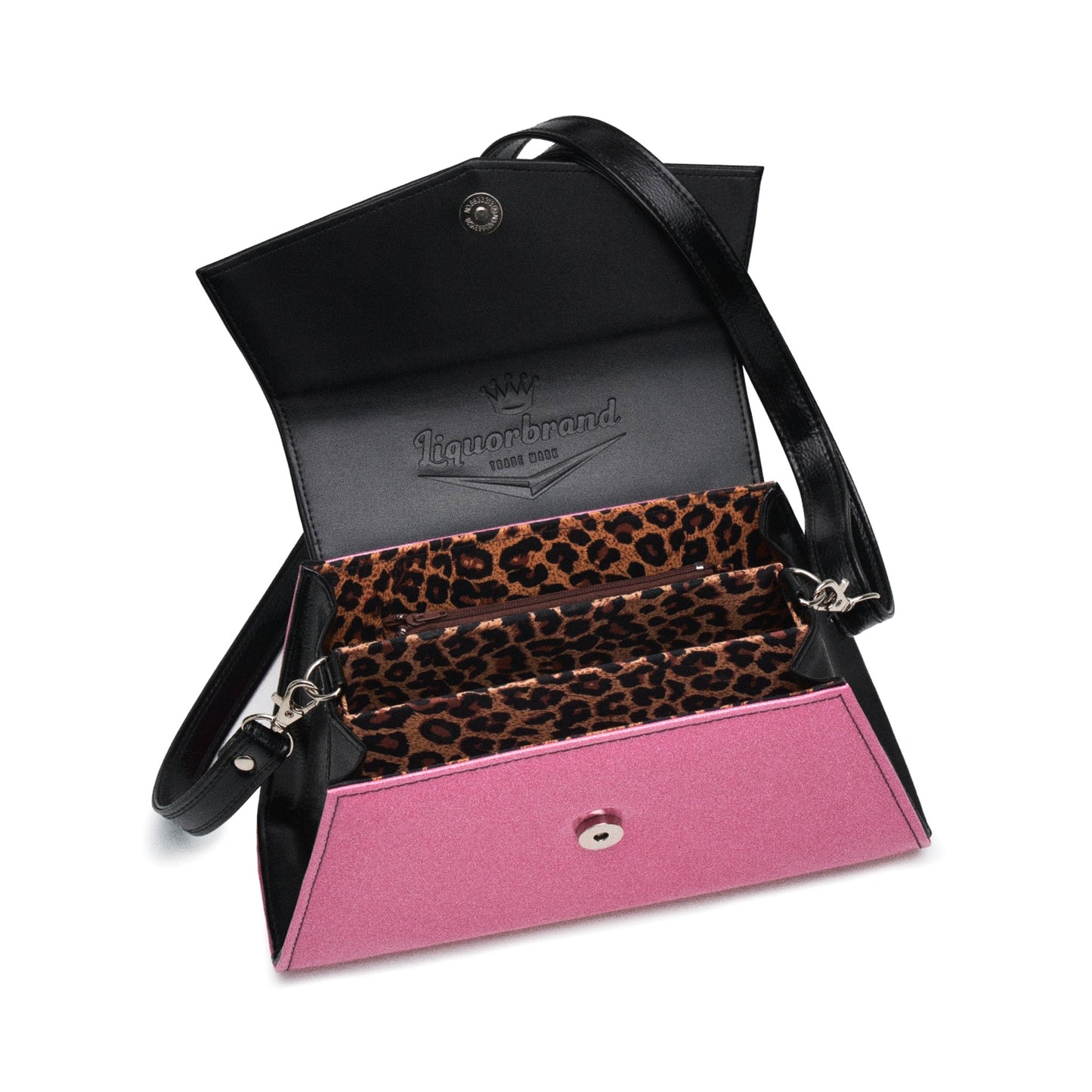 Interior del bolso bicolor abierto, mostrando el forro de leopardo y el logo de Liquorbrand grabado en la solapa.