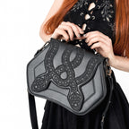  Rigid black crossbody bag with embroidered snakes - worn by model