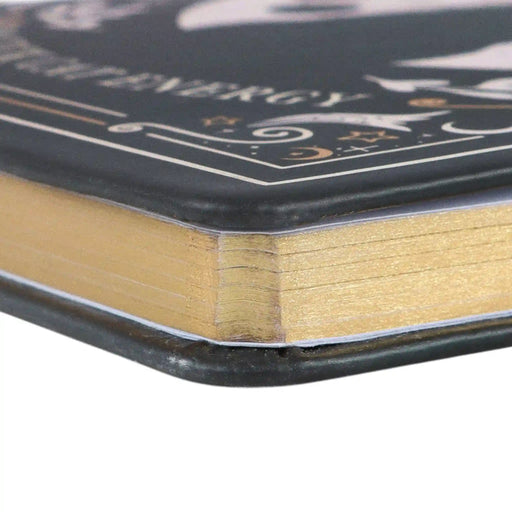 Vista de detalle del canto de la libreta con acabado dorado.