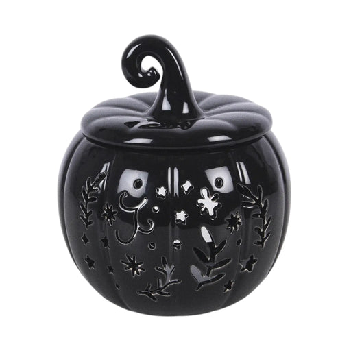Quemador de aceites esenciales y calentador de cera en forma de calabaza con diseño calado otoñal perfecta para halloween y otoño en color negro vista frontal sobre fondo blanco.
