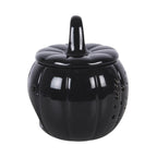 Quemador de aceites esenciales y calentador de cera en forma de calabaza con diseño calado otoñal perfecta para halloween y otoño en color negro vista lateral sobre fondo blanco.