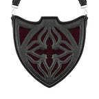 Bolso bandolera negro con diseño rígido en forma de escudo inspirado en las catedrales y la arquitectura medieval con detalles en terciopelo burdeos modelo Claretia de Restyle vista frontal