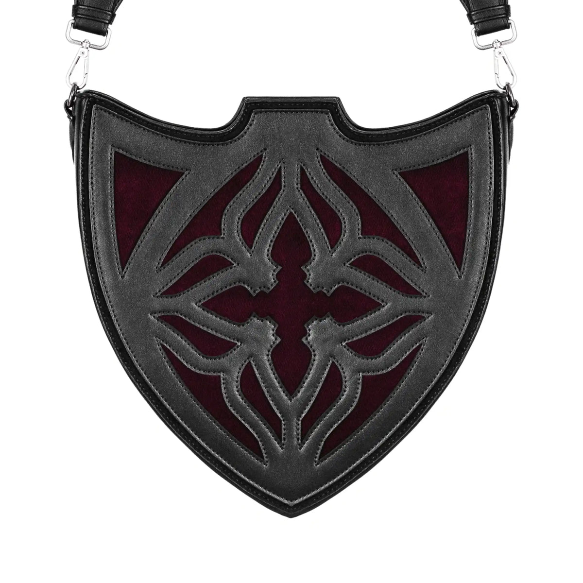 Bolso bandolera negro con diseño rígido en forma de escudo inspirado en las catedrales y la arquitectura medieval con detalles en terciopelo burdeos modelo Claretia de Restyle vista frontal