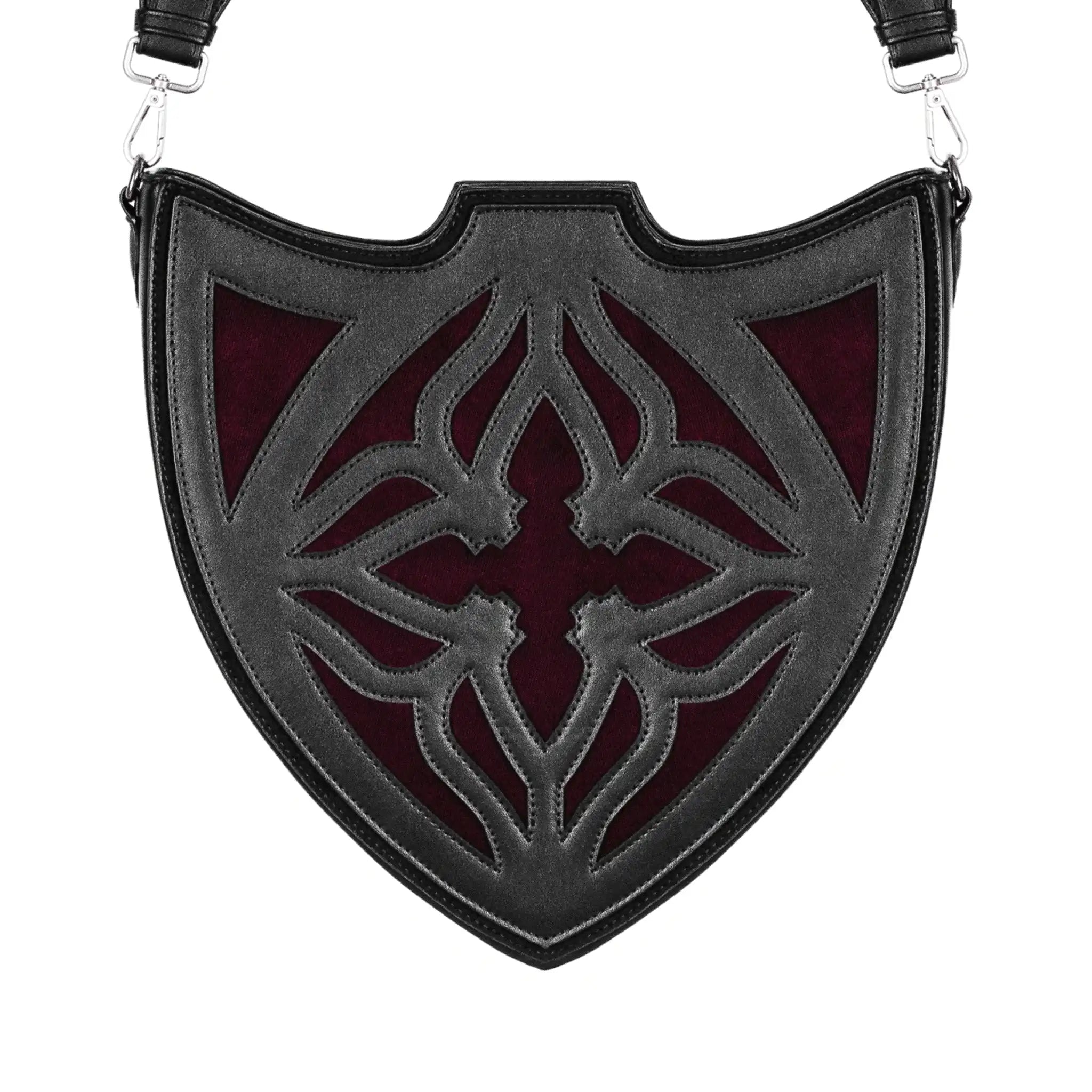 Bolso bandolera negro con diseño rígido en forma de escudo inspirado en las catedrales y la arquitectura medieval con detalles en terciopelo burdeos modelo Claretia de Restyle vista frontal