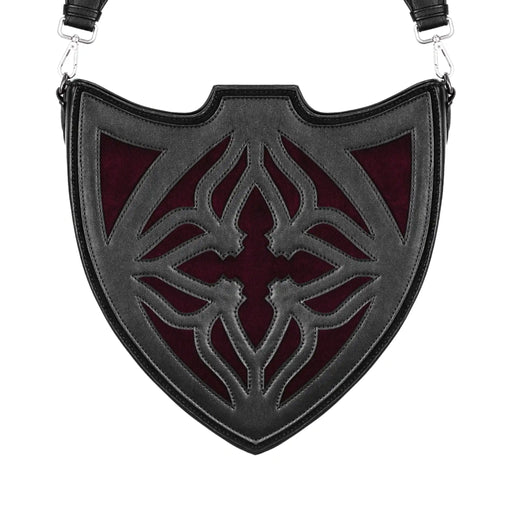Bolso bandolera negro con diseño rígido en forma de escudo inspirado en las catedrales y la arquitectura medieval con detalles en terciopelo burdeos modelo Claretia de Restyle vista frontal