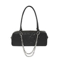 Elongated gothic shoulder bag with an embossed skull and a decorative silver chain