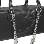  Detail of the embossed skull design and silver chain on the black bag