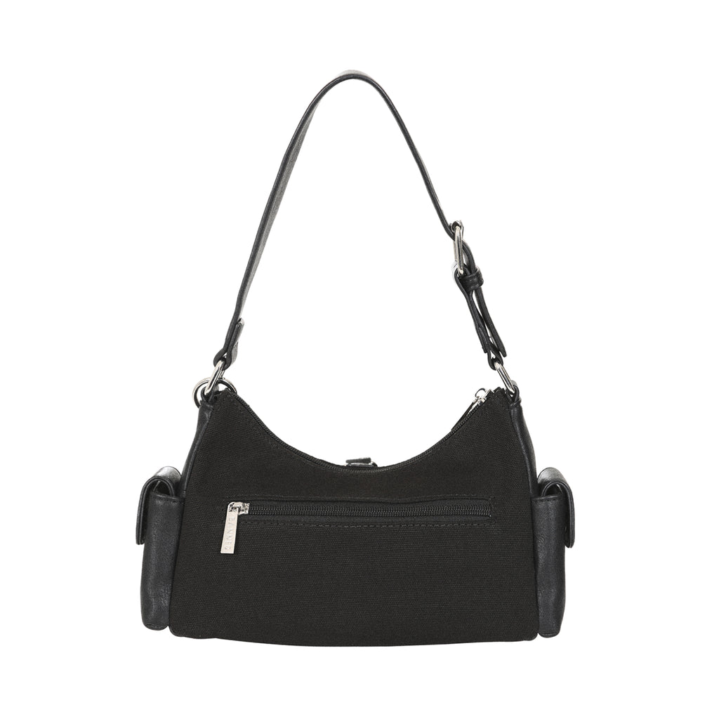 Vista trasera del bolso gótico Y2K, mostrando el cuerpo de lona y el bolsillo exterior con cremallera.