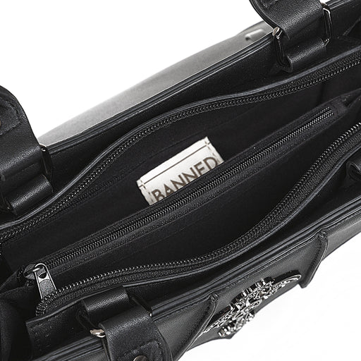 Interior del bolso gótico mostrando los tres compartimentos principales, uno de ellos con cremallera.