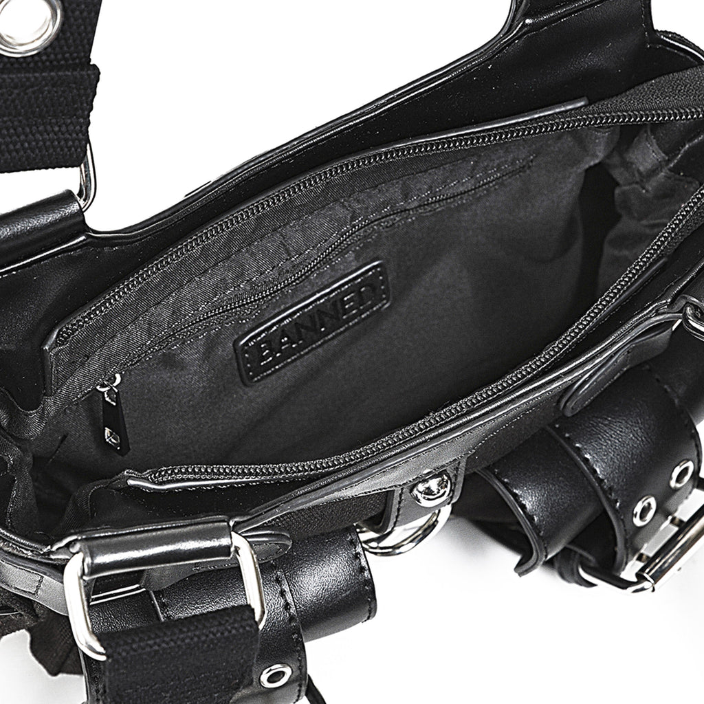 Interior del bolso mostrando el bolsillo con cremallera y los dos compartimentos abiertos.