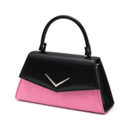 Bolso Liquorbrand bicolor pin-up en negro y rosa brillante con el emblemático aplique Chevron.