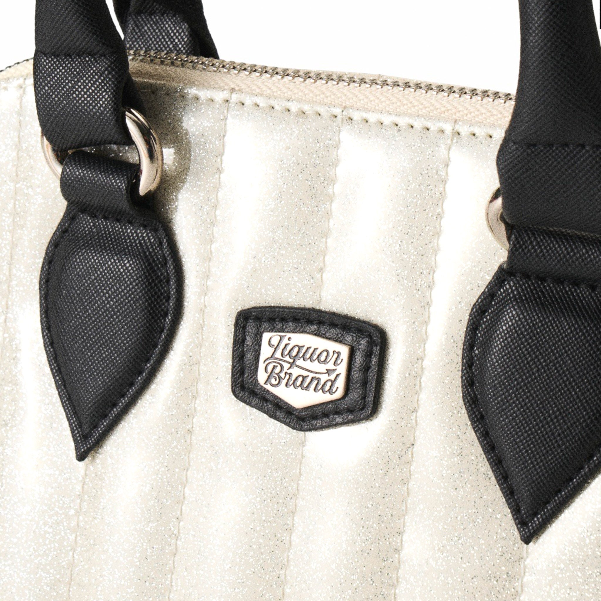  Close-up of Liquorbrand logo patch on the vertical stitching of the white glitter bag