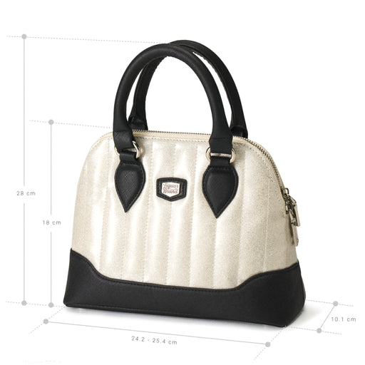 Bolso Lil' Rocket bicolor blanco brillo/negro con dimensiones: 24.5 cm de ancho por 18 cm de alto.