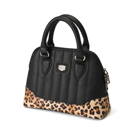 Bolso Lil' Rocket angulado, mostrando la base de leopardo, costuras y las asas superiores.

