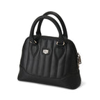 Bolso mini Lil' Rocket negro, angulado, destacando la textura de la piel y el parche del logo.