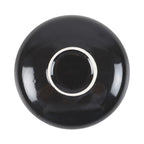 Plato de joyería redondo negro con diseño de serpiente enroscada en flores, estrellas y luna vista desde abajo con fondo blanco.