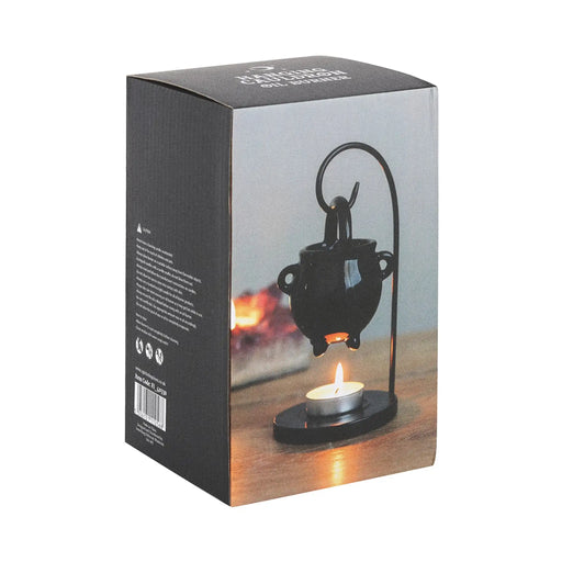 Quemador de aceites esenciales colgante con forma de caldero de bruja estilo witchy gótico vista packaging sobre fondo blanco.