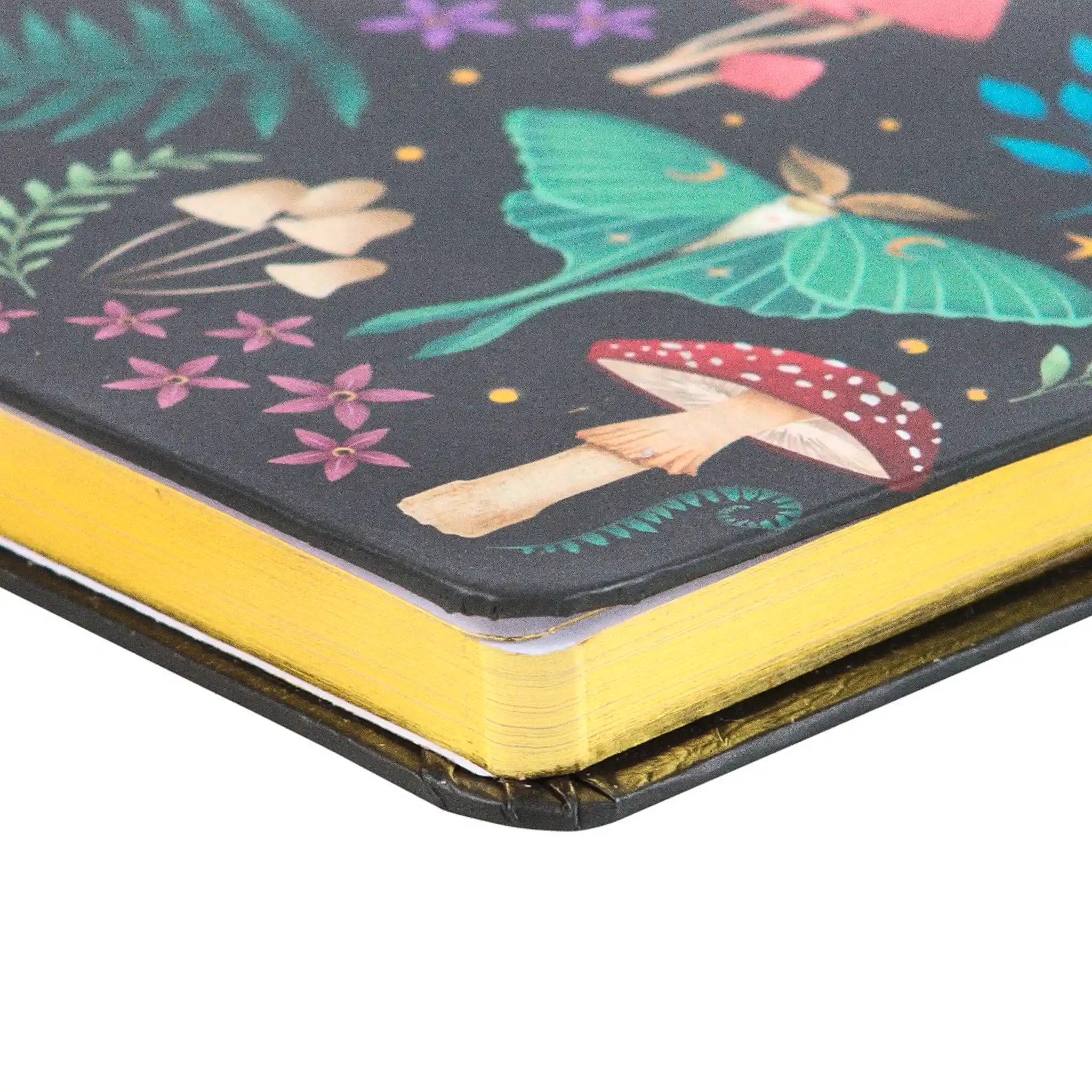 Detalle de cantos de hojas libreta en dorado.