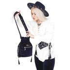 Back view of model wearing Restyle Lunar Eclipse midnight blue velvet bucket bag