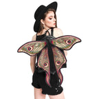 Mochila con alas móviles en forma de polilla con bordado de alta densidad en colores otoñales modelo Metamorphosis de Restyle vista con modelo alas abiertas