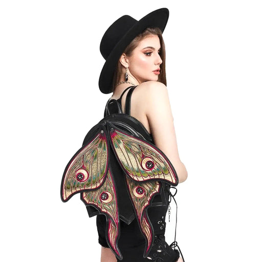 Mochila con alas móviles en forma de polilla con bordado de alta densidad en colores otoñales modelo Metamorphosis de Restyle vista con modelo en hombro