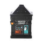 Quemador de aceite y calentador de cera con forma de librería encantada estilo spooky halloween vista de frente sobre fondo blanco.