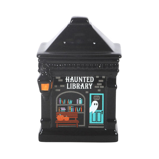 Quemador de aceite y calentador de cera con forma de librería encantada estilo spooky halloween vista de frente sobre fondo blanco.