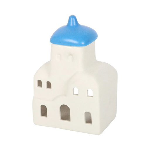 Quemador de aceites esenciales y calentador de cera con forma de casa de Santorini inspirado en Grecia en blanco y azul vista frontal sobre fondo blanco.