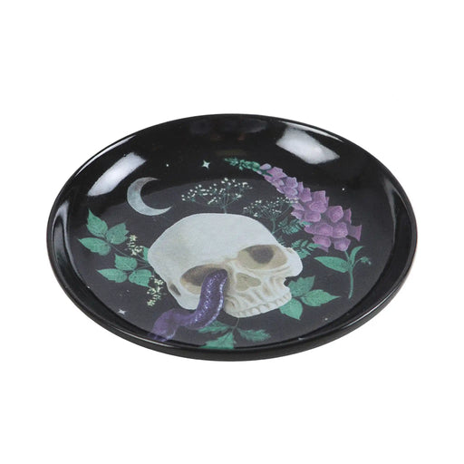 Plato para joyería con diseño de calavera, serpiente y plantas estilo gótico visto desde un lateral sobre fondo blanco.